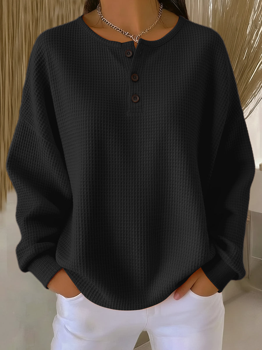 Milagros textured Henley sweatshirt in black, front view