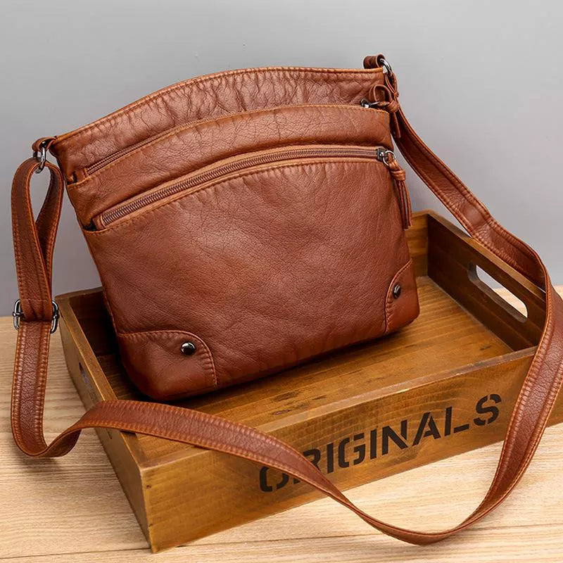 Celine leather shoulder bag in brown, front view with long strap