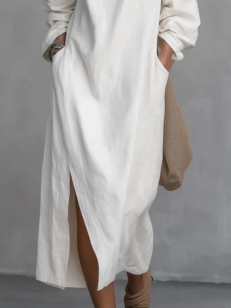 One shoulder midi dress in white, close-up of split hem and side pocket
