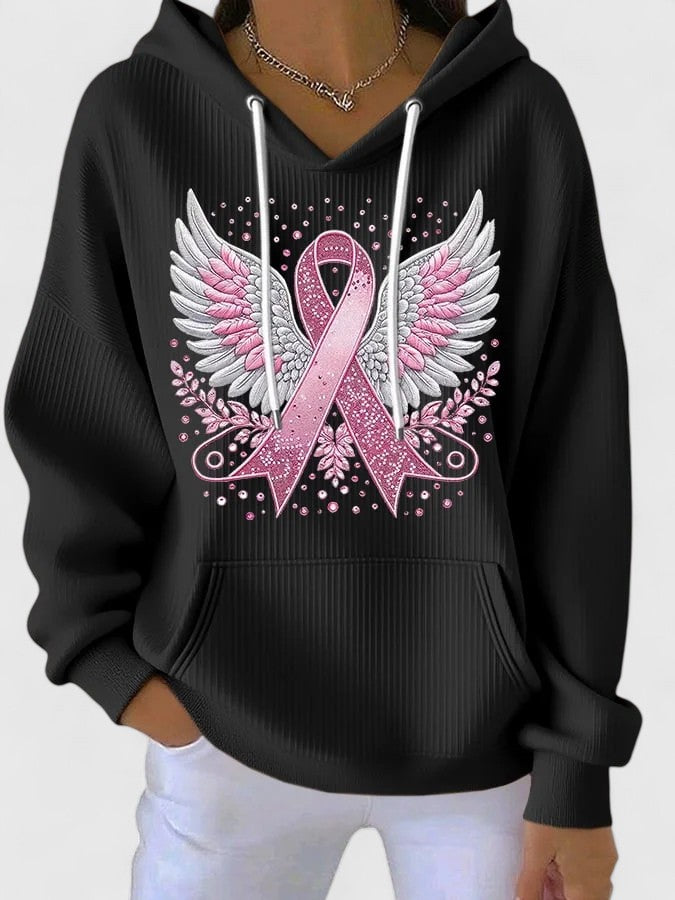 Serenica hooded top in black with pink winged ribbon print, front view
