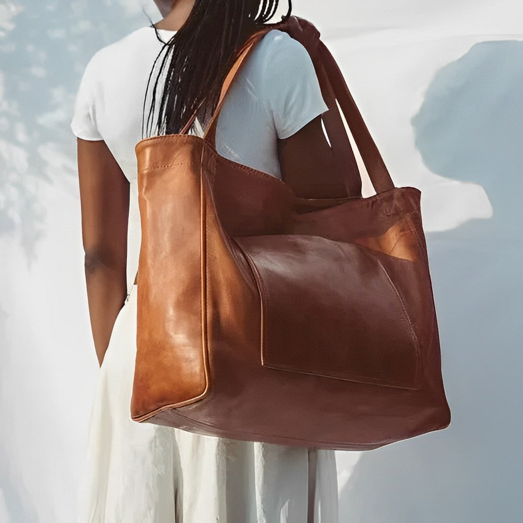 Oriane retro leather tote bag in brown carried over the shoulder