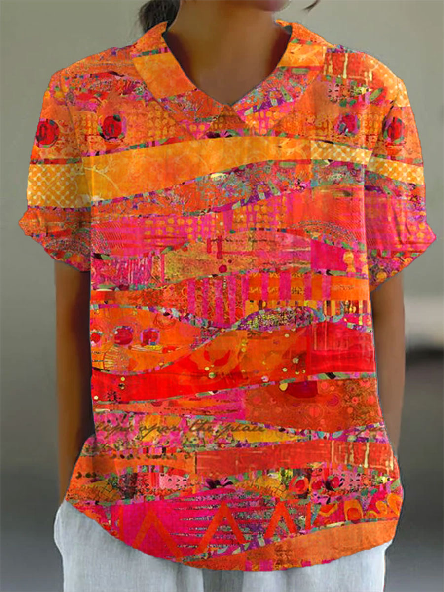 Isla abstract print blouse in orange and pink, front view worn with white trousers