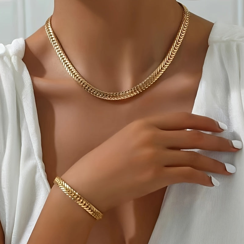 Gold fox tail necklace and bracelet set worn on neck and wrist