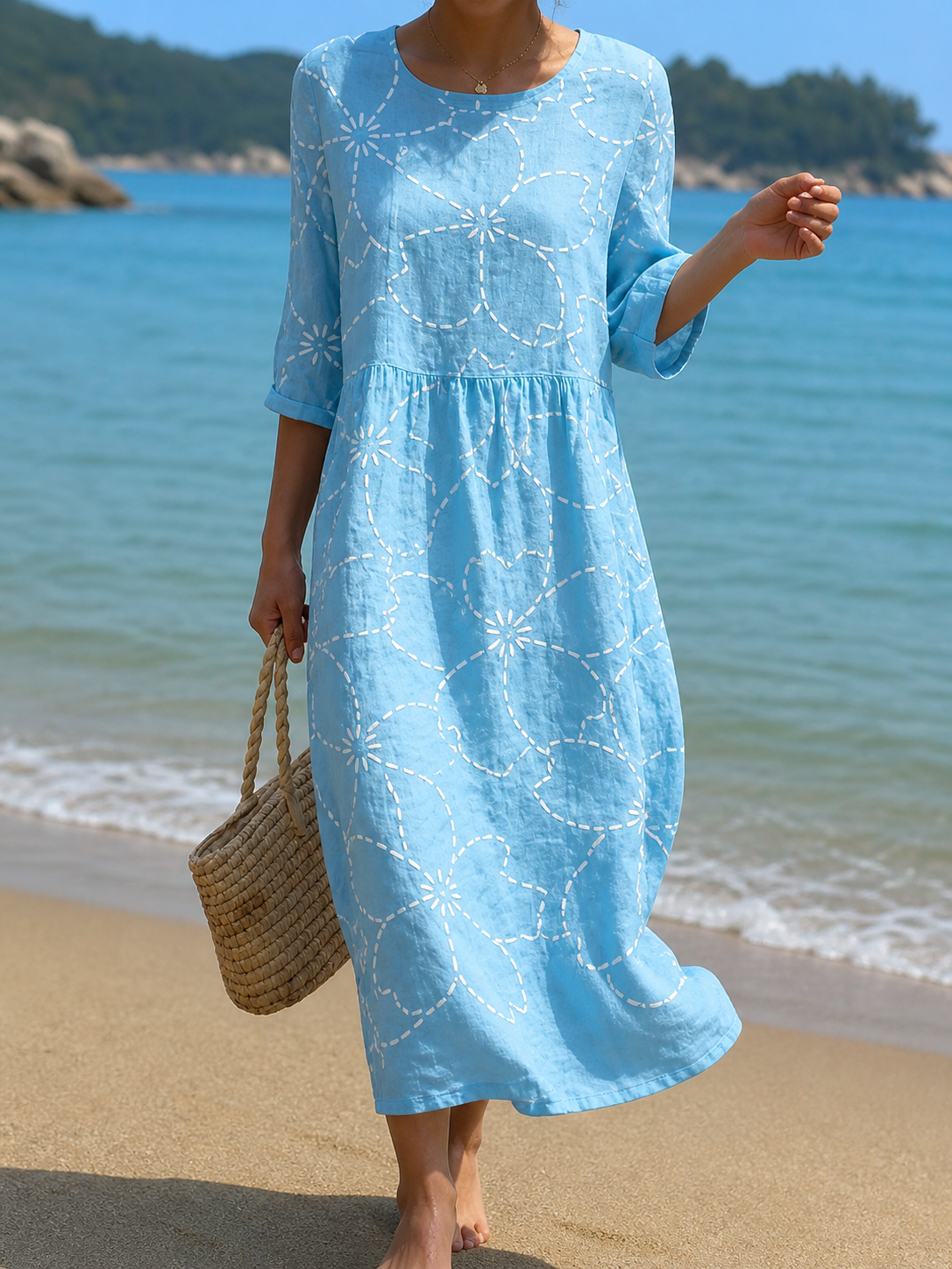 Casual floral print midi dress in sky blue, full-length front view on the beach