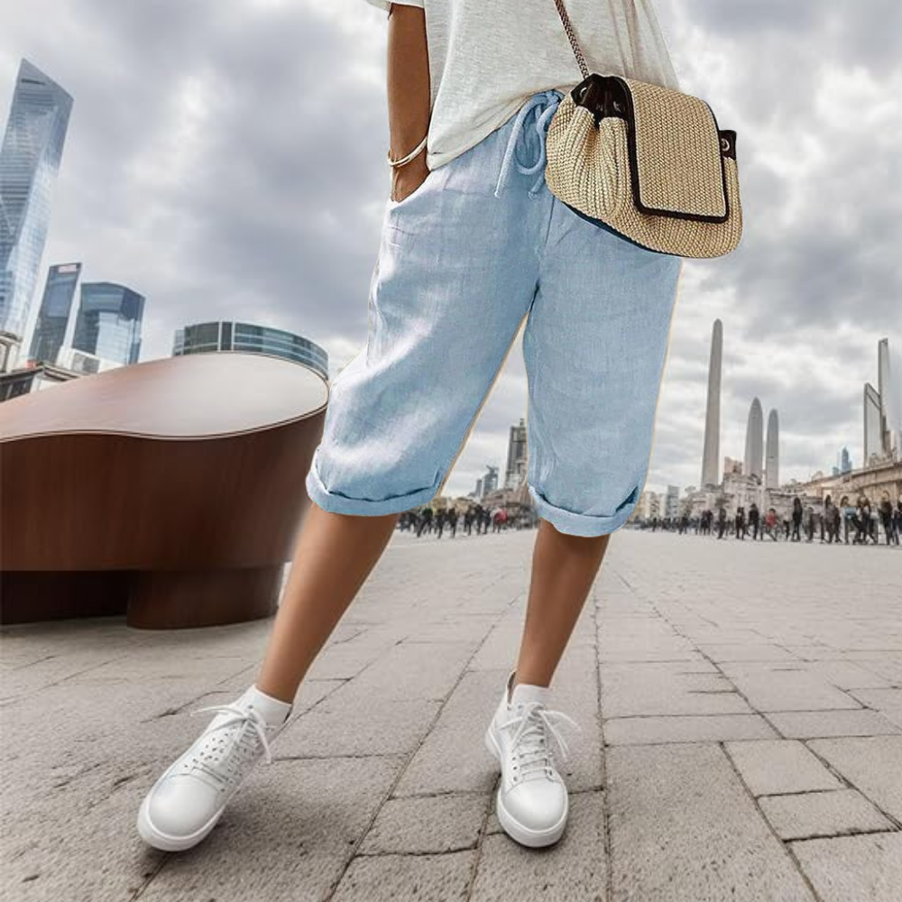 Noa cotton linen shorts in light blue, front view on model