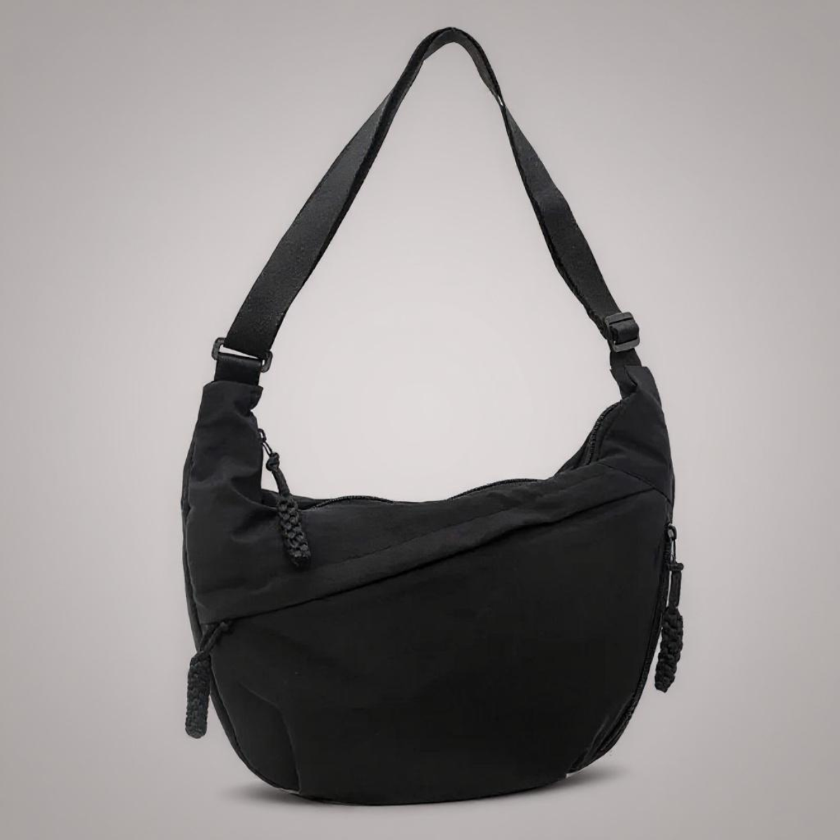 Evelyn shoulder bag in black, crescent shape with adjustable strap