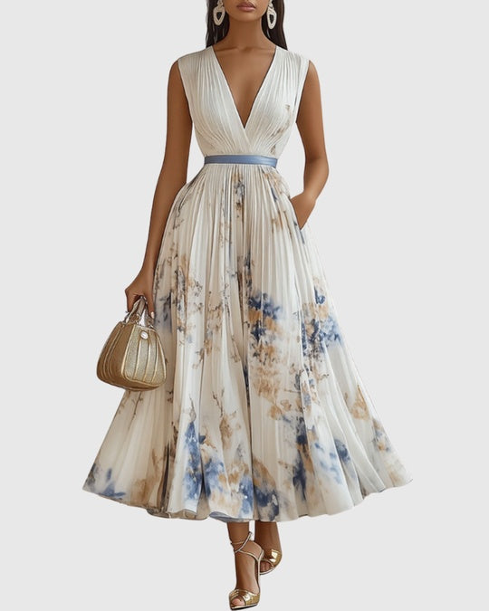 Paz floral pleated dress in cream with blue print, sleeveless front view