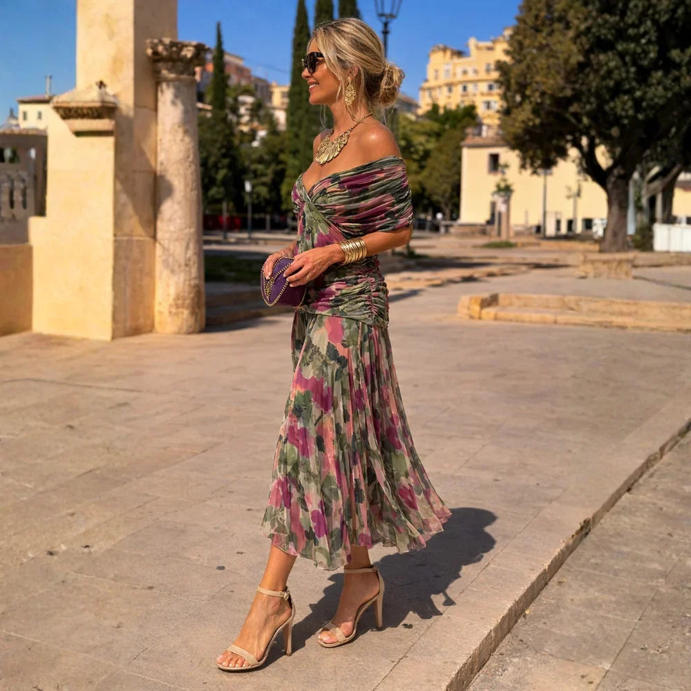 Eliza maxi dress in green and pink floral print, side view walking