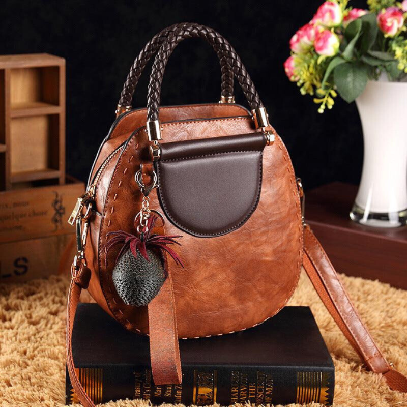 Naelle crossbody bag in caramel, front view with braided handles
