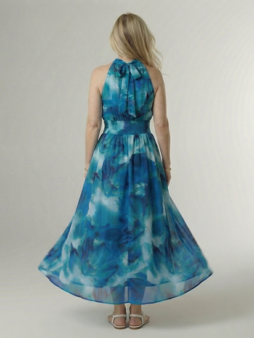 Sylin halter midi dress in blue, back view with bow detail