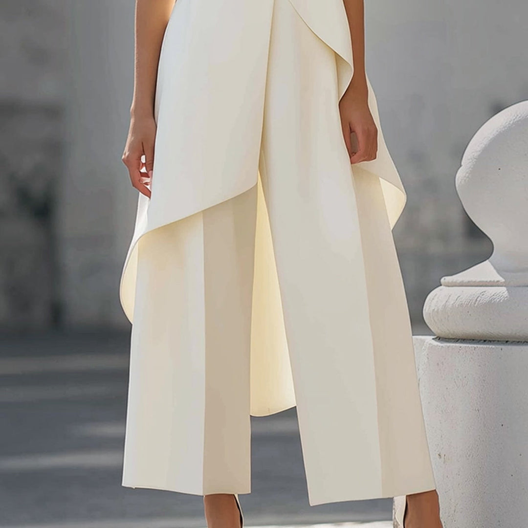 Valentina jumpsuit in white, close-up of wide-leg trousers and overlay