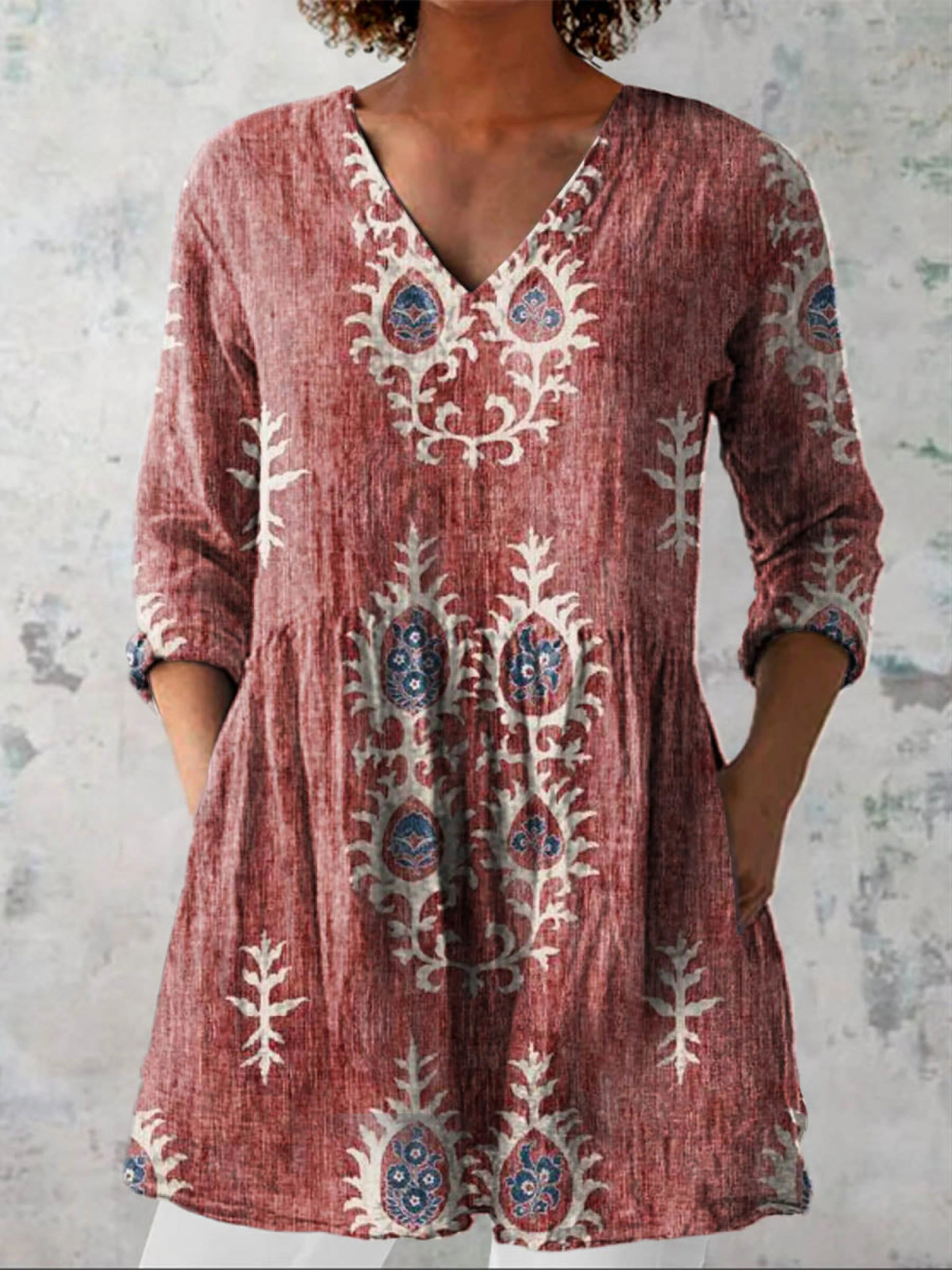 Elise long V-neck blouse in red with pale floral motifs, front view