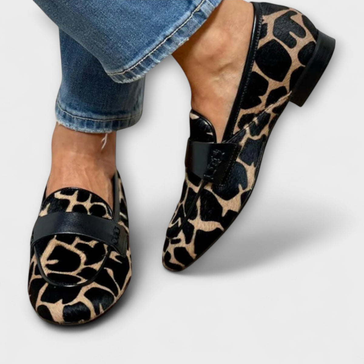 Paula loafers in black and sand print, side view showing black instep trim