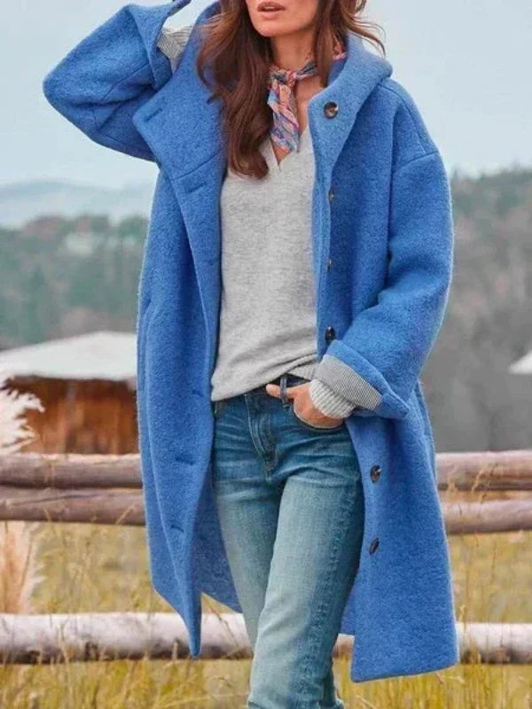 Virginia long hooded coat in blue, worn open over jeans