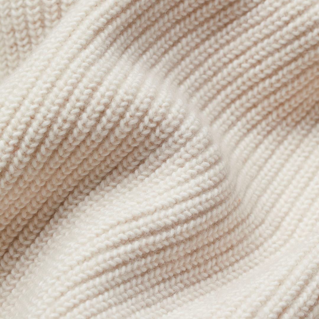 Close-up of Mabel cardigan chunky ribbed knit texture in cream