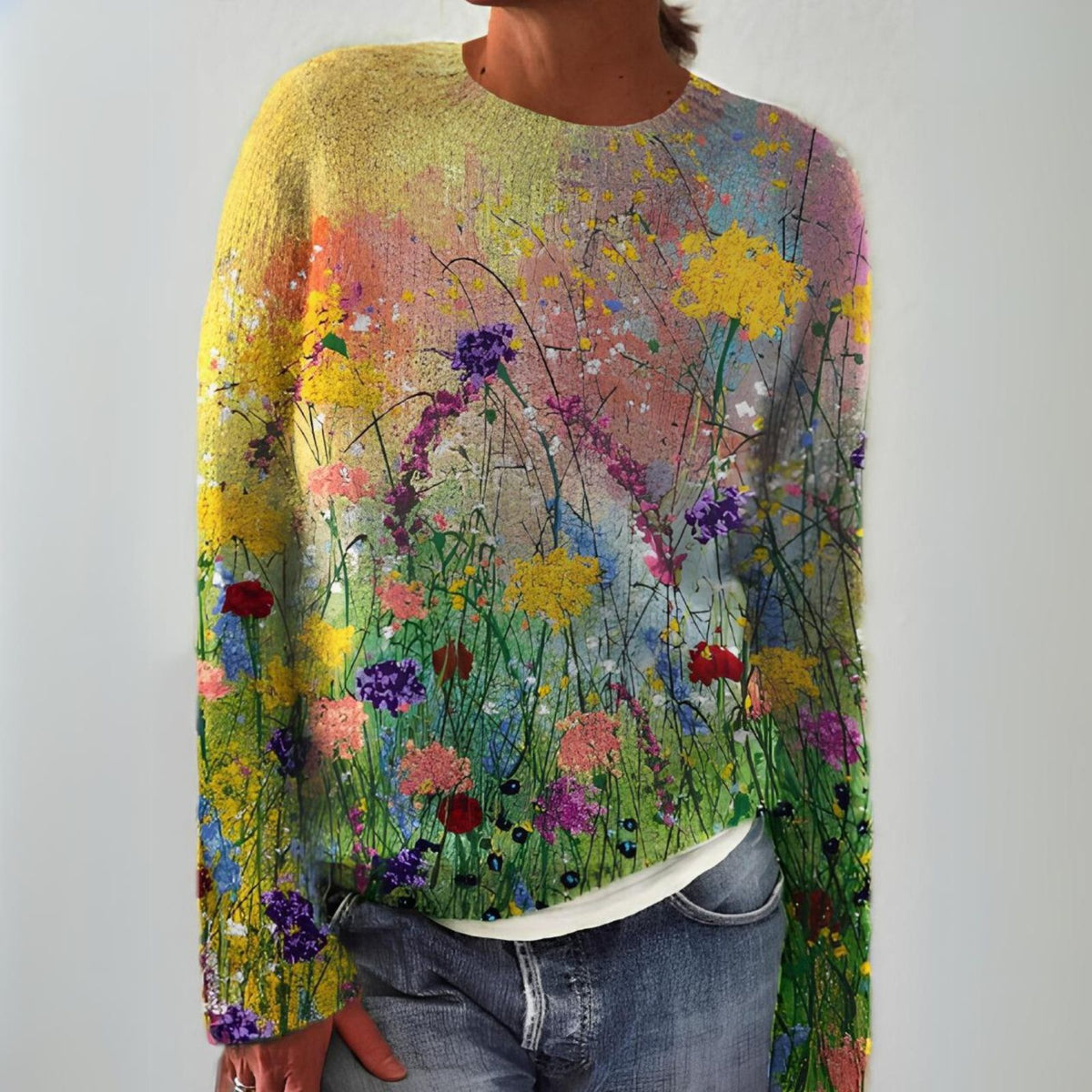 Thessia sweater in multicoloured wildflower print, front view worn with jeans