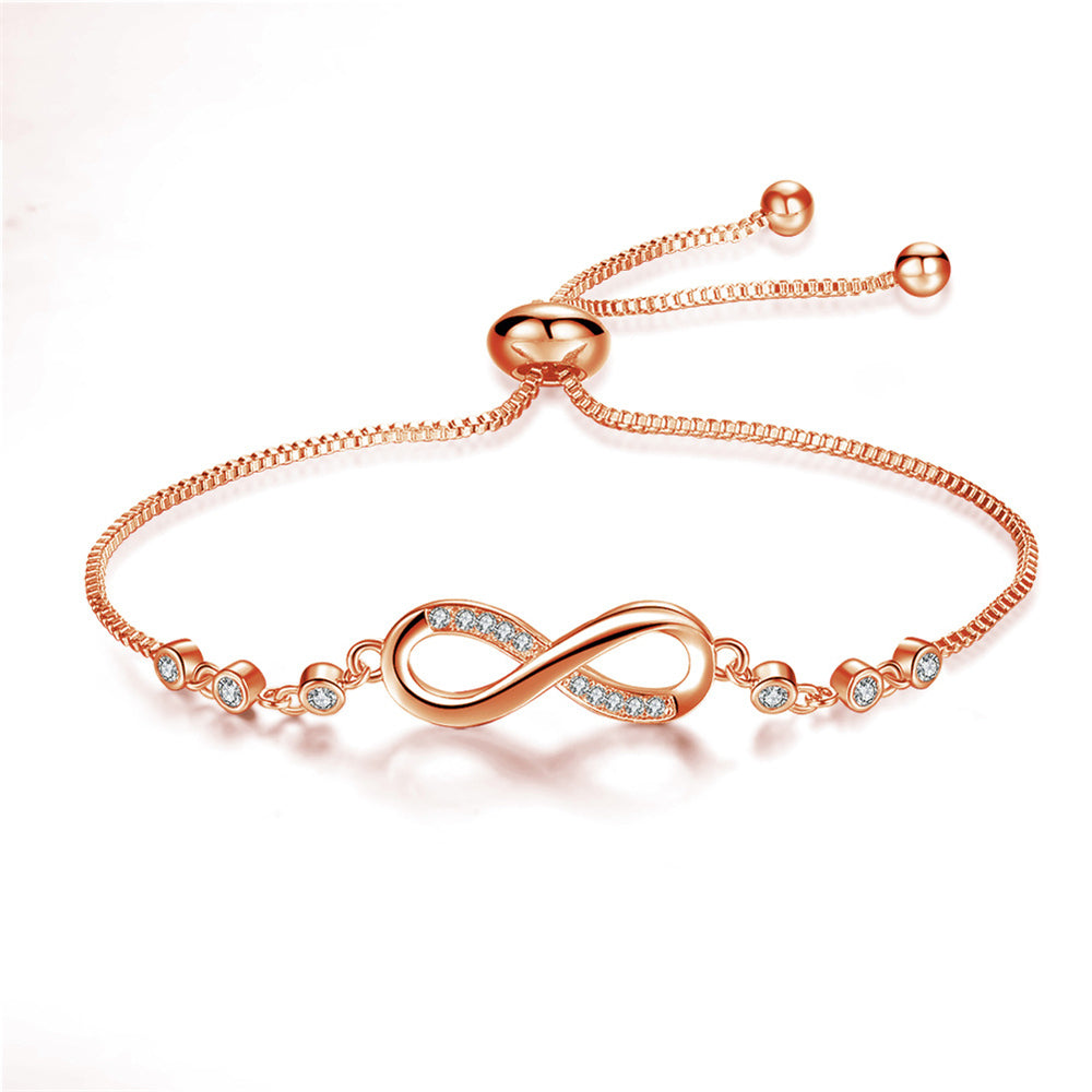 Infinity symbol bracelet in rose gold, full view with sparkling accents