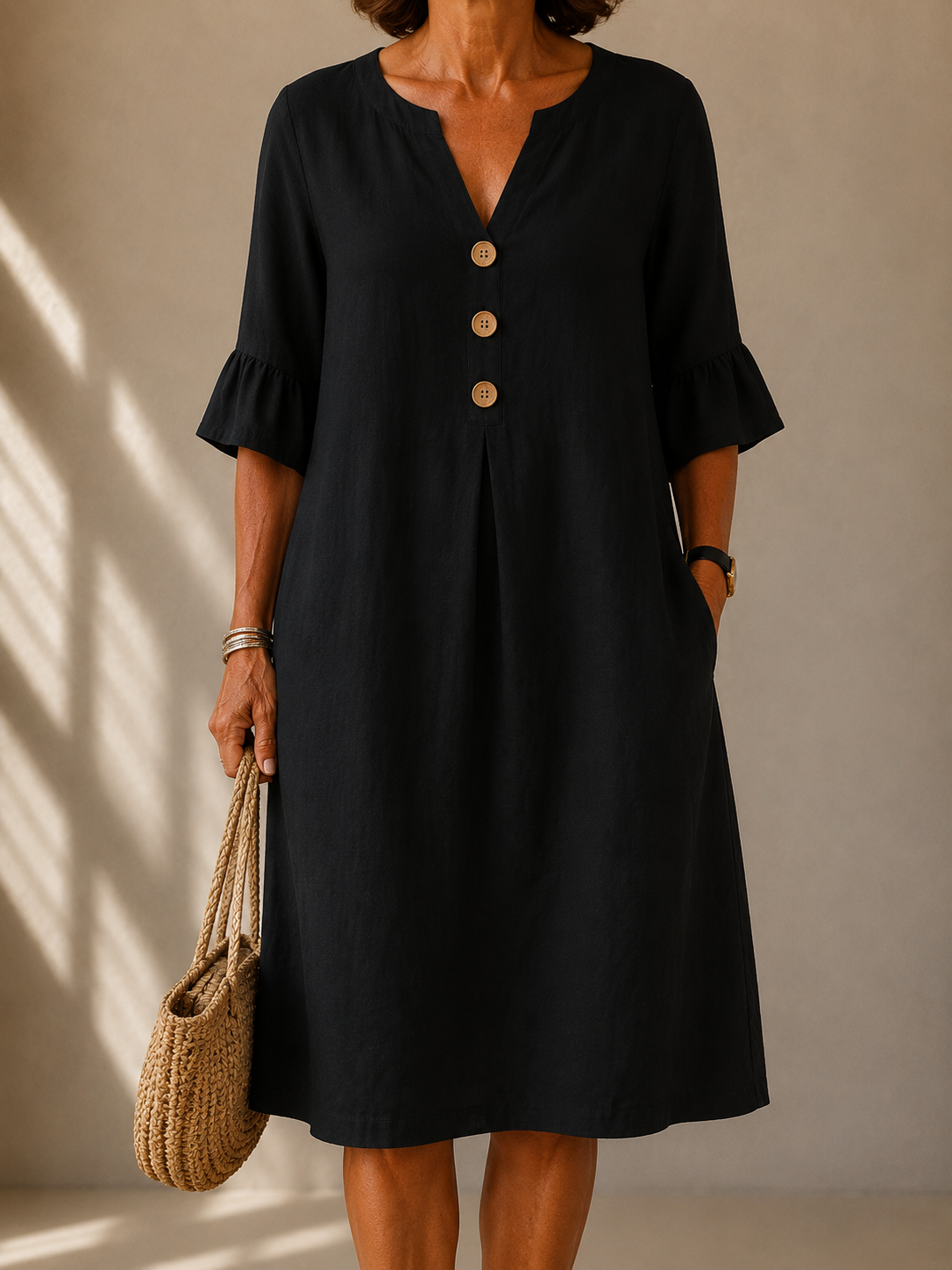 Isabelle buttoned flowy dress in black, front view