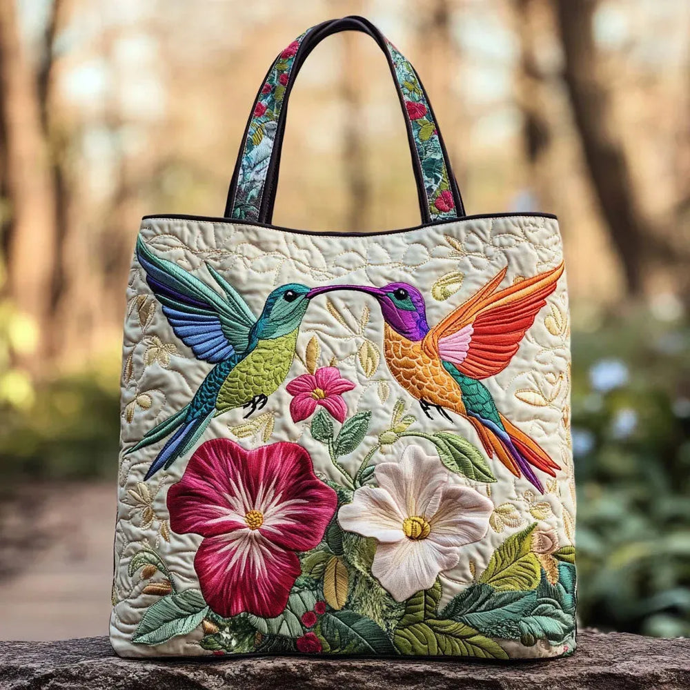Handcrafted hummingbird tote bag in cream, front view with pink and white flowers