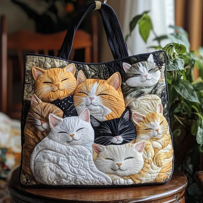 Handcrafted quilted tote bag with sleeping cat appliqué in ginger, white and grey, front view