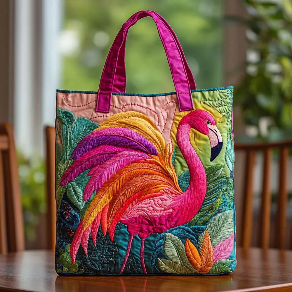 Handcrafted rainbow flamingo tote bag with pink handles, front view on a table
