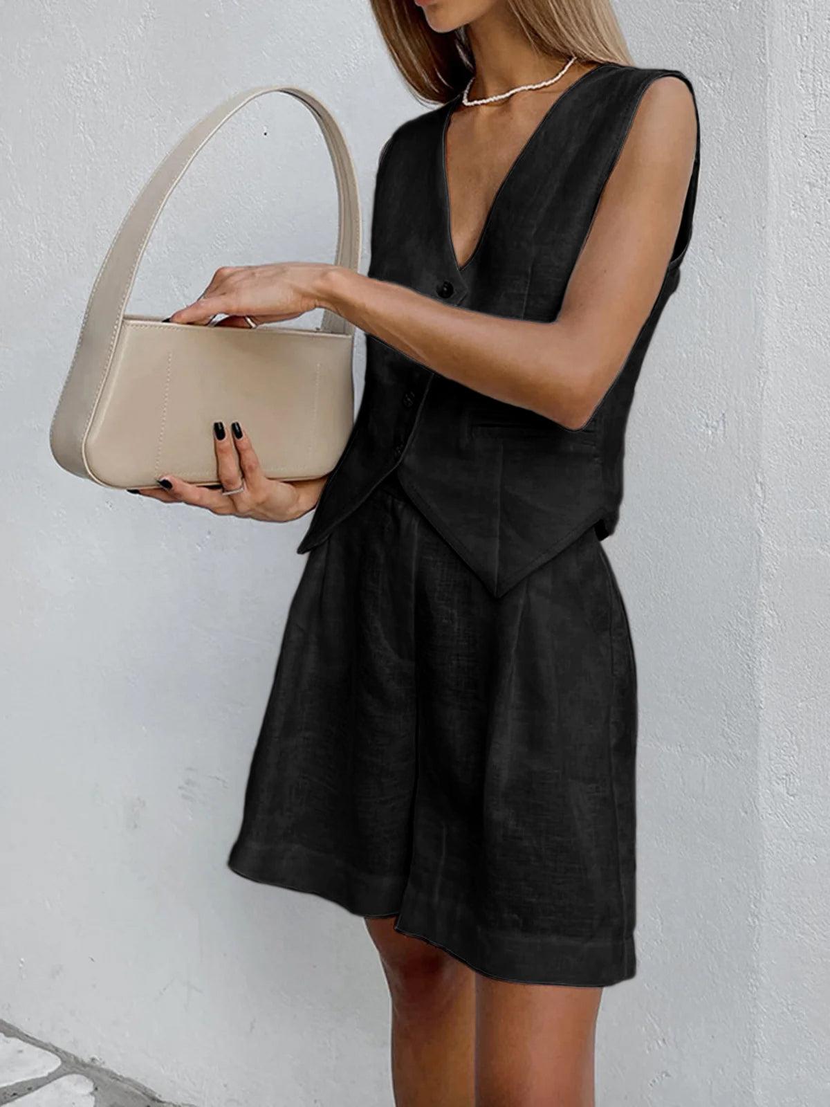 Sophia two piece shorts set in black, side view with handbag