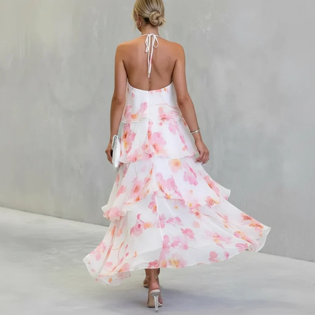 Estrella tiered floral dress in white and pink, back view with halter tie and open back