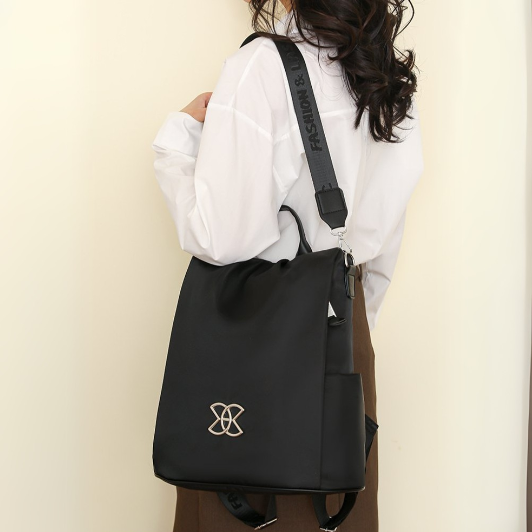BeBold backpack in black carried on the shoulder with wide strap