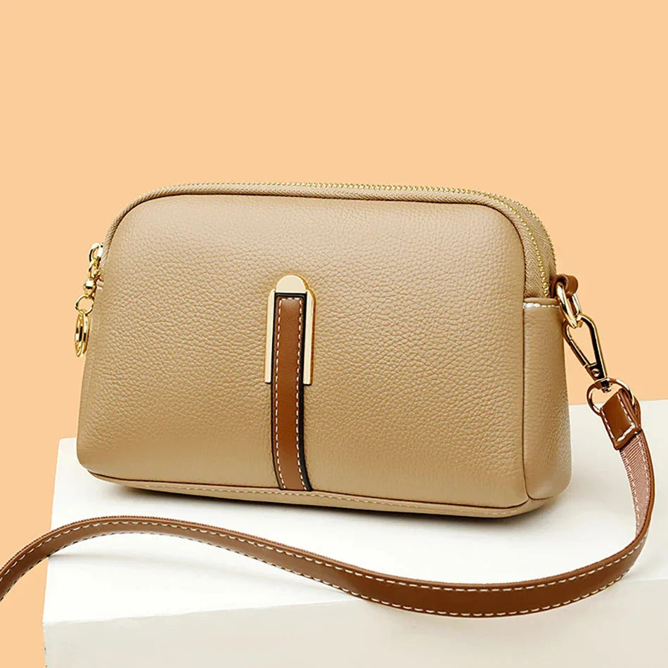Emanuela crossbody bag in beige with tan strap, front view