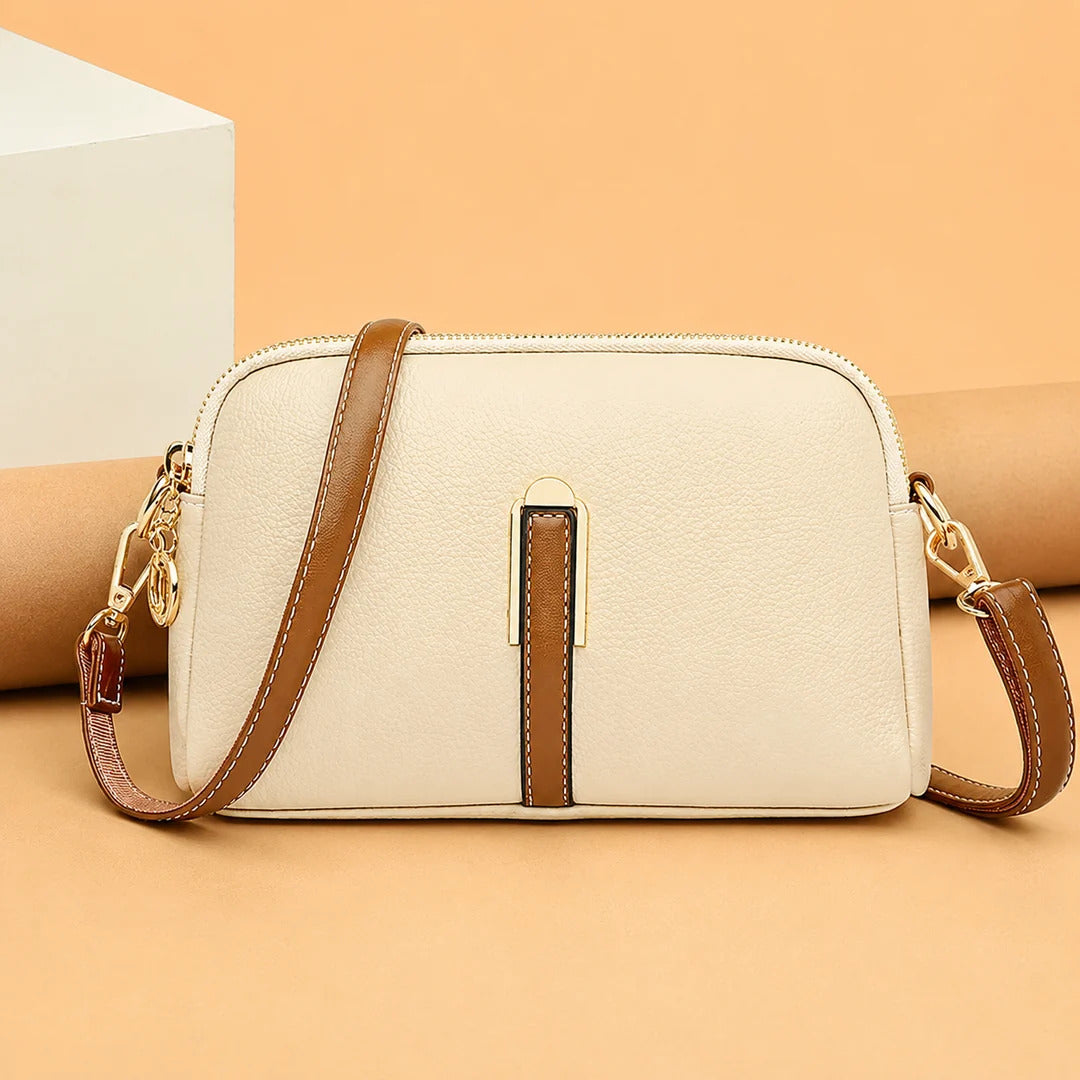 Emanuela crossbody bag in white with tan strap, front view