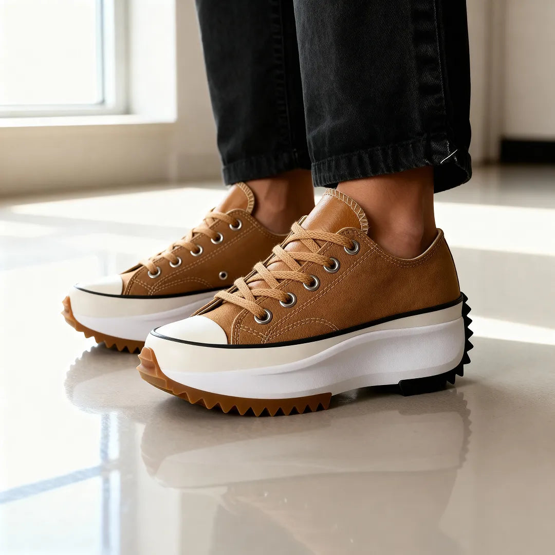 Clara orthopaedic platform shoes in brown, worn with black jeans, side view