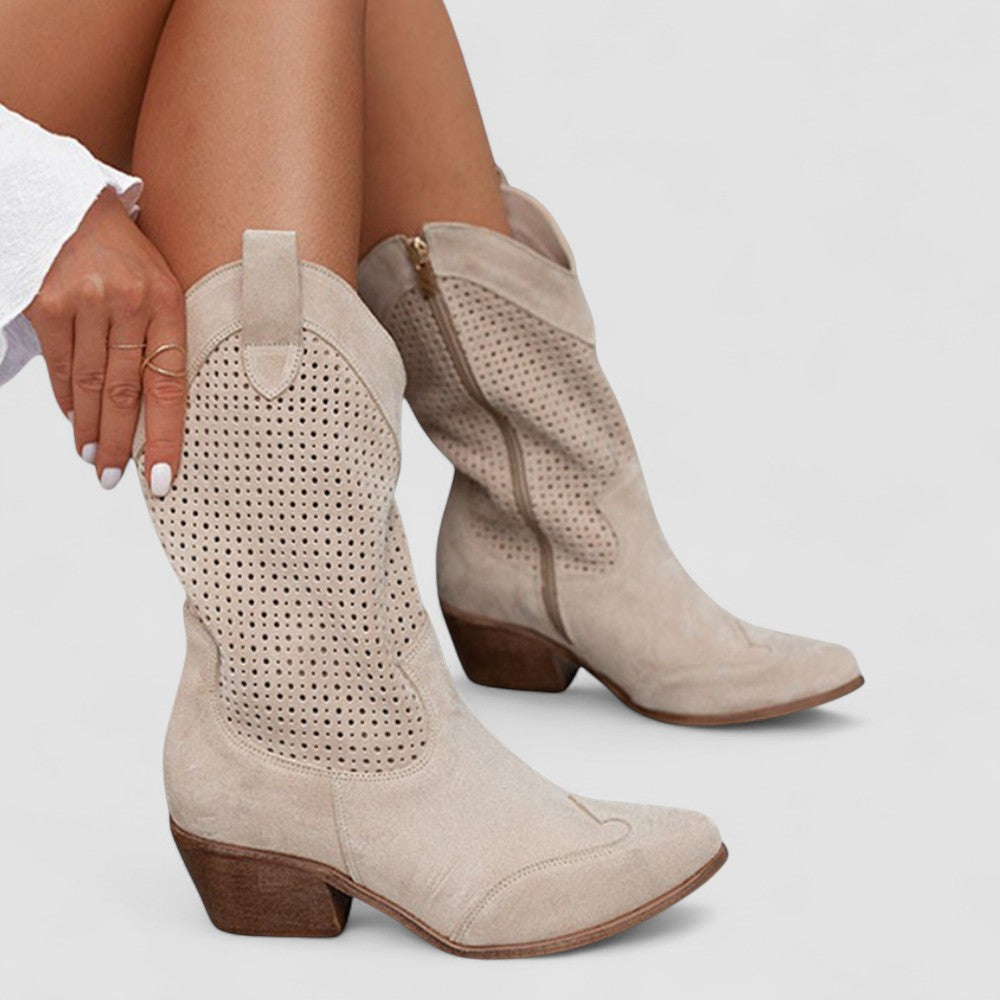 Quinn perforated Western boots in beige, seated side view