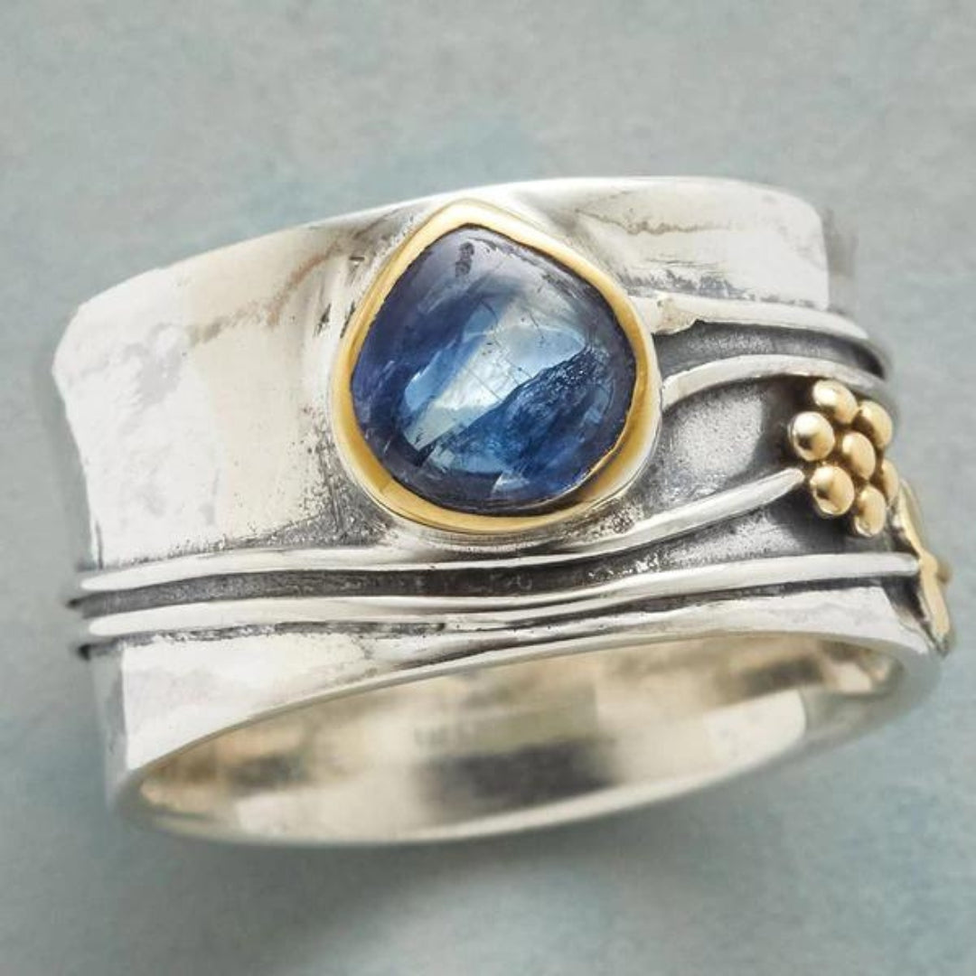 Bohemian gemstone meditation ring in silver with blue stone, close-up view