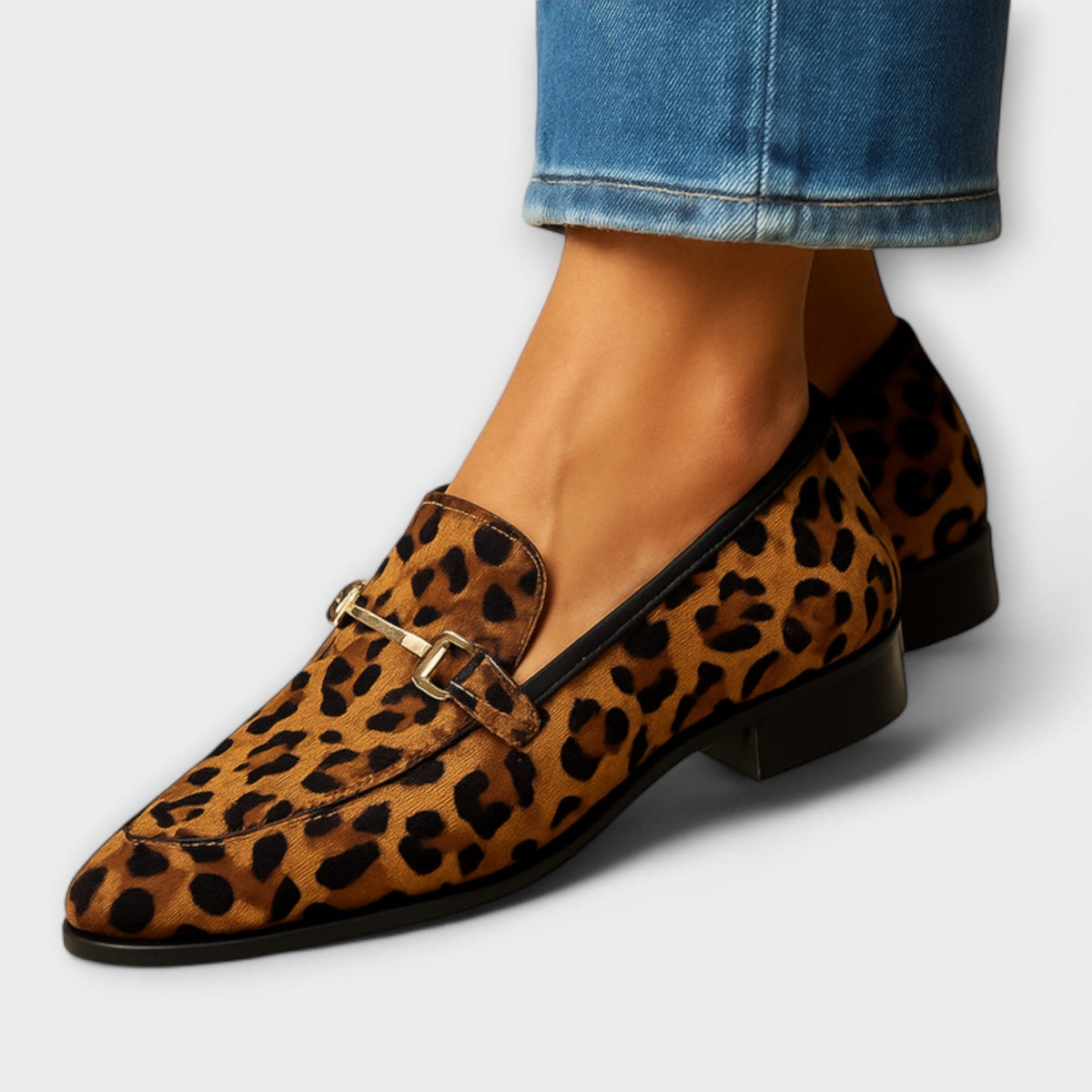 Valeria elegant loafers in leopard print, worn with cropped jeans, side view