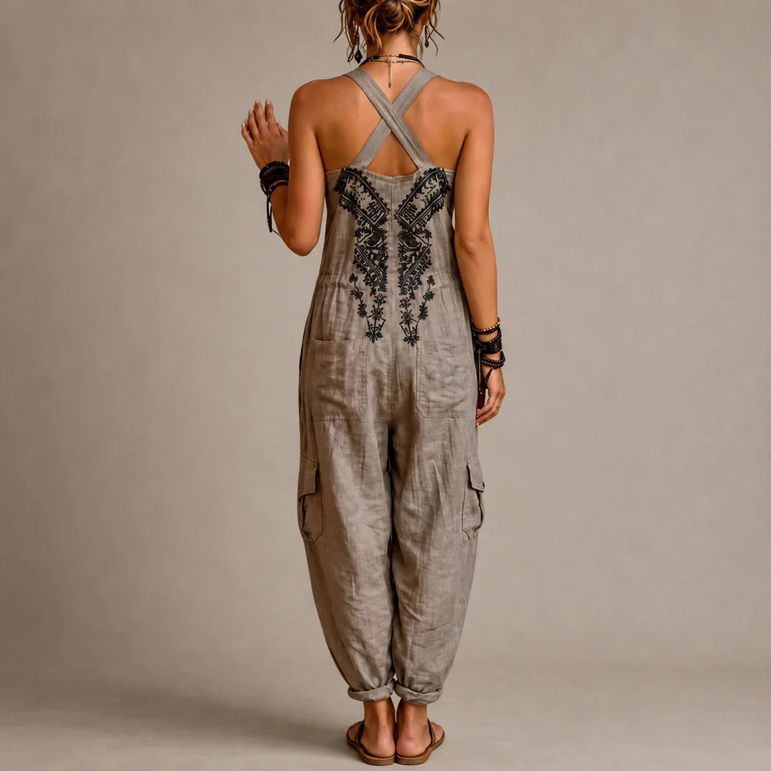 Wren harem jumpsuit in taupe grey, back view showing crossed straps