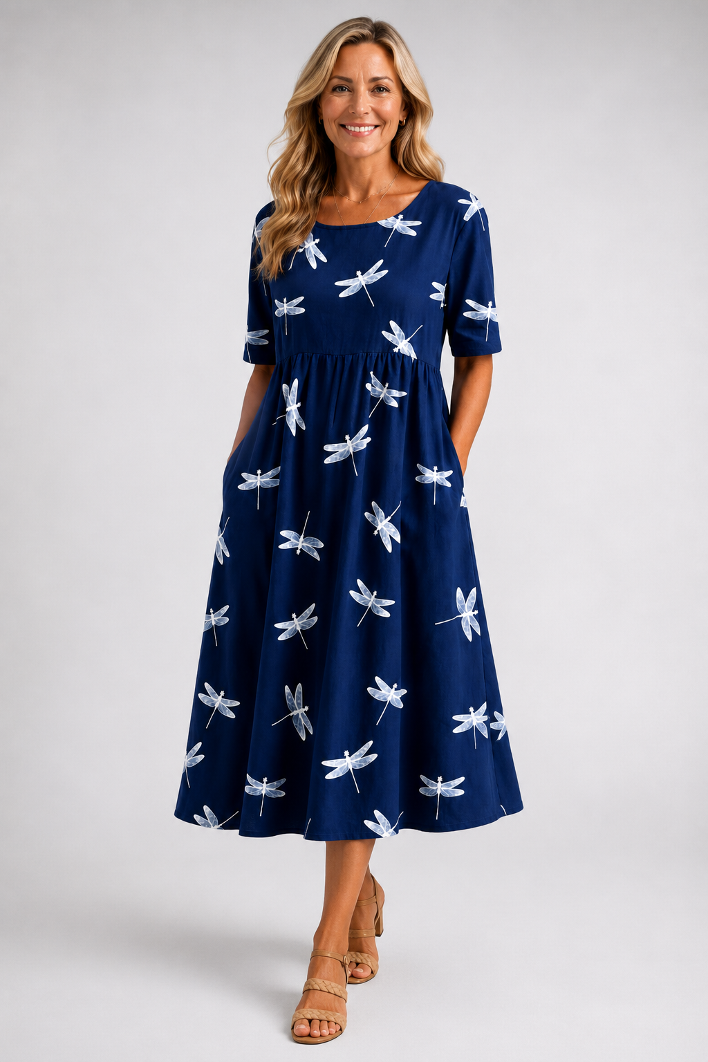 Evelina dragonfly midi dress in navy, front view with hands in pockets
