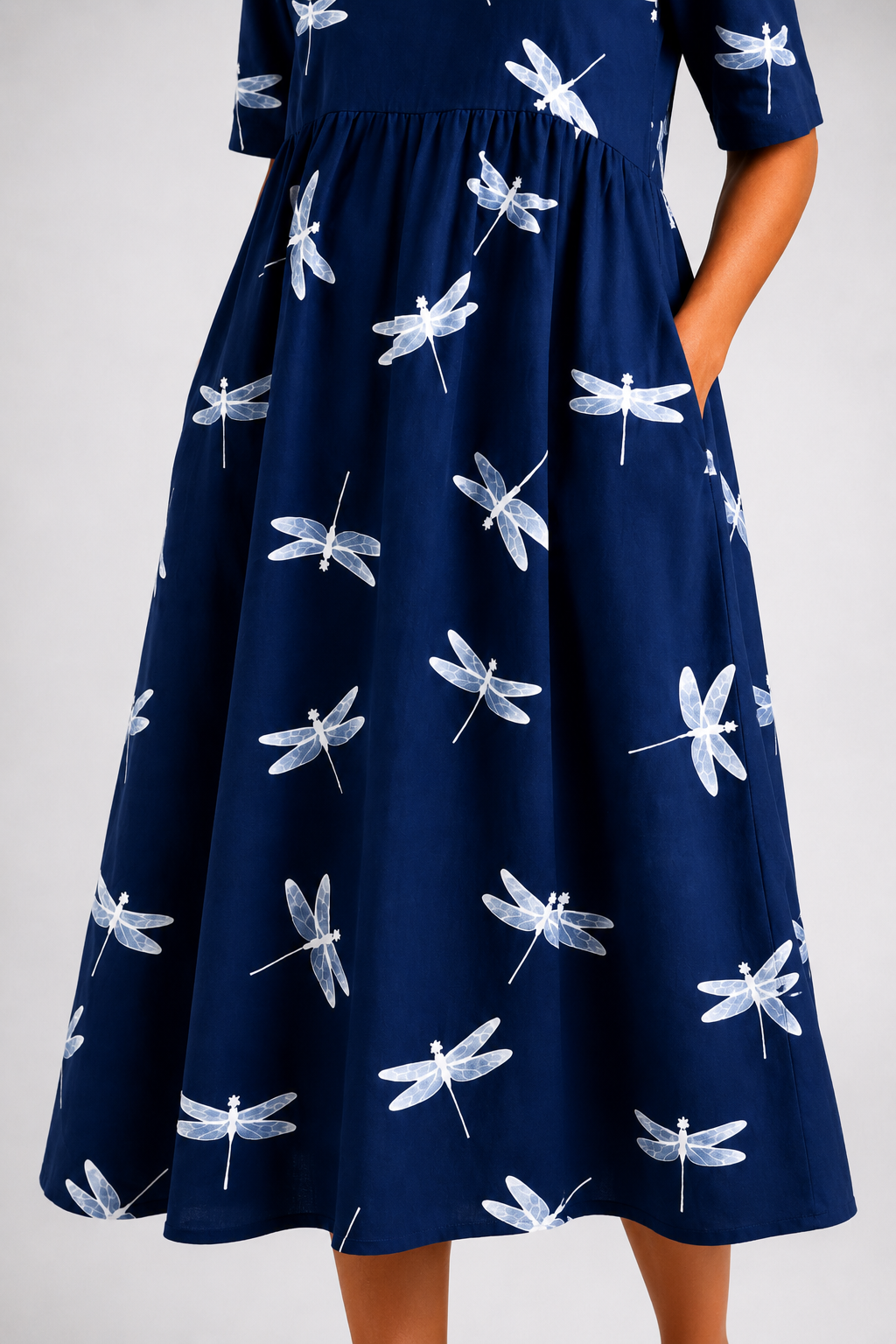 Evelina dragonfly midi dress in navy, close-up of skirt and side pocket