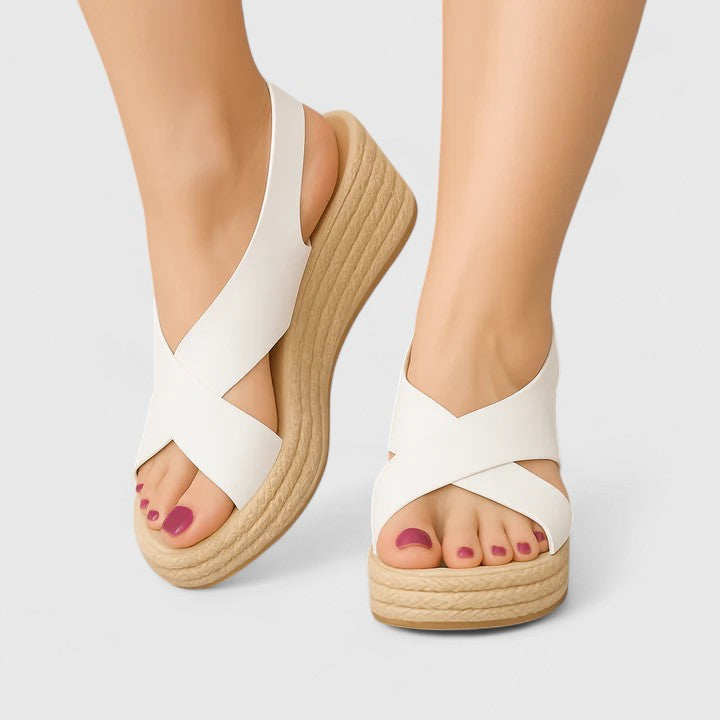 Marilysa crossover wedge sandals in white, worn front view