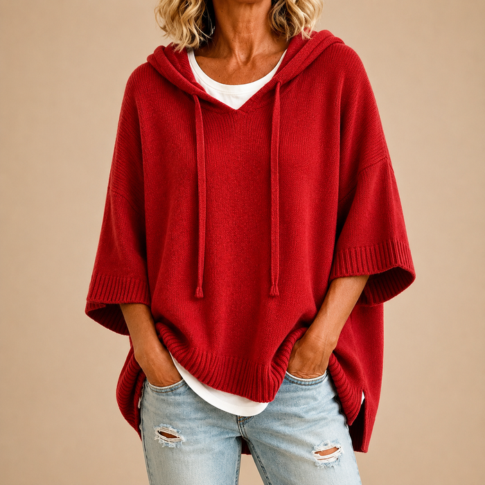 Hooded knit poncho in red, front view