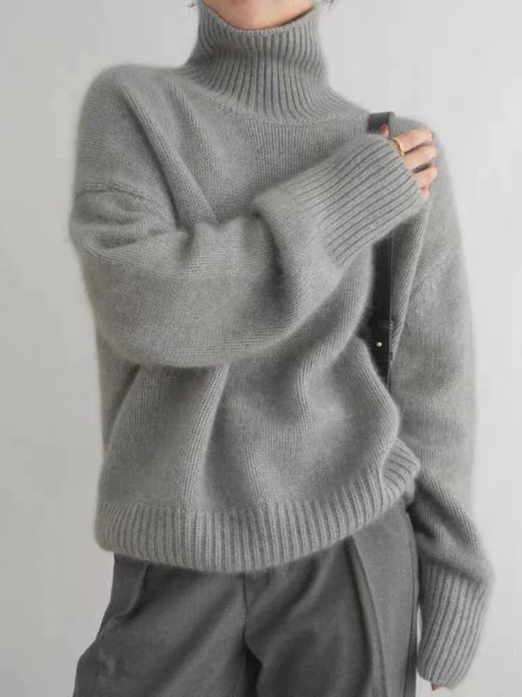 Isaboll high-neck sweater in grey, close view of ribbed cuffs and hem