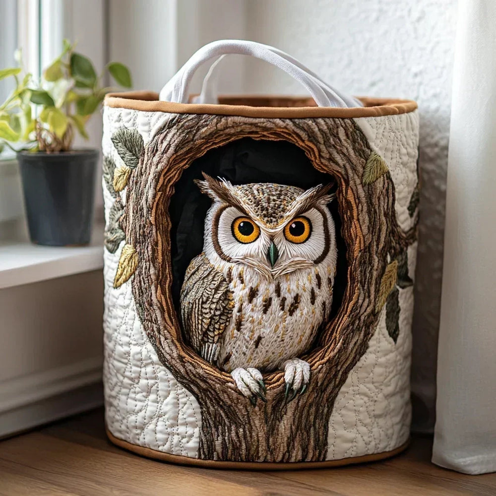 Fernanda hand-quilted laundry basket with embroidered owl in a tree hollow