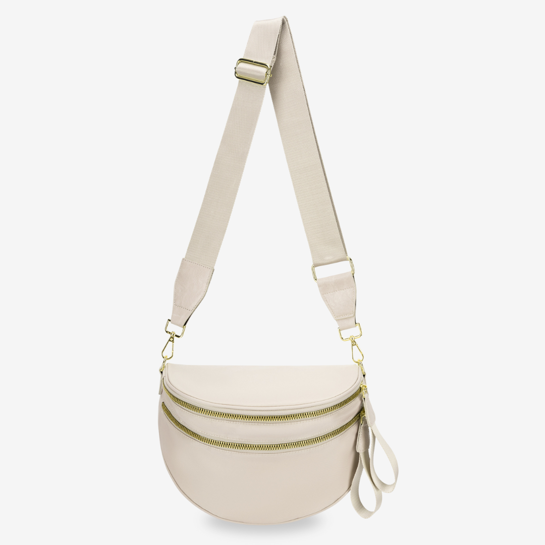Dionne crossbody bag in beige, front view with twin gold zips