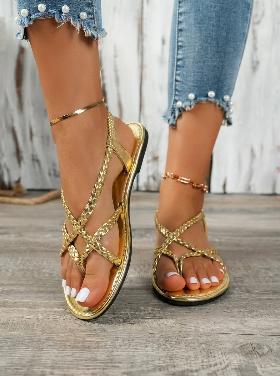 Luceria braided flat sandals in gold, worn side view