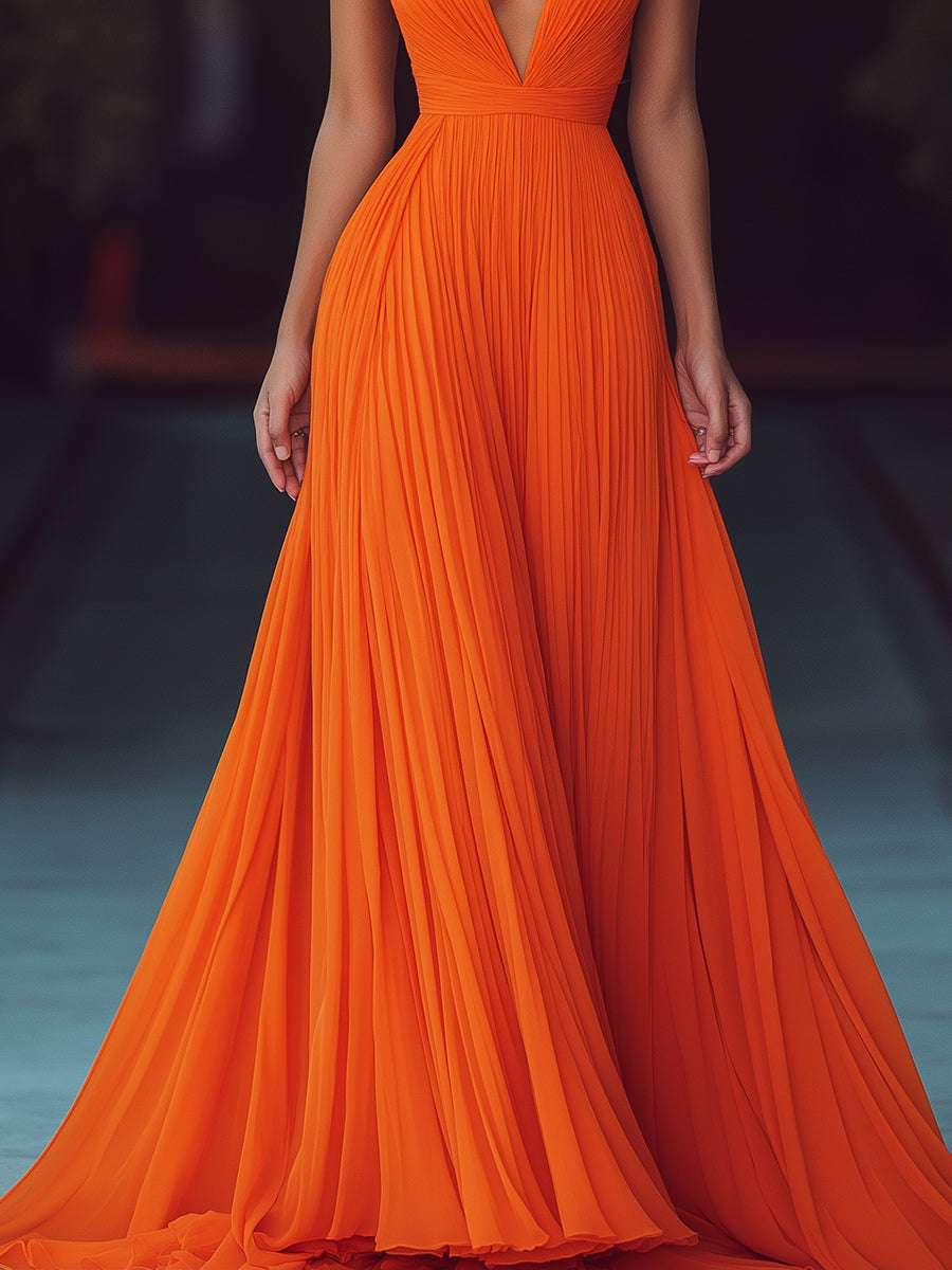 Vesperina maxi dress in orange, close-up of pleated skirt and waistband