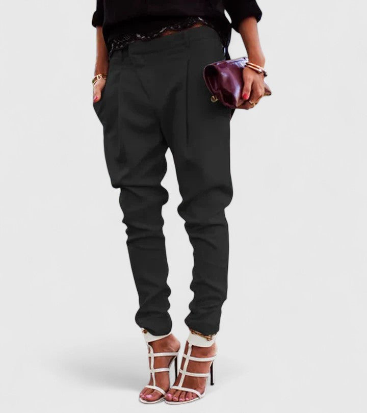 Marceline elegant tapered trousers in black, front view with white heels