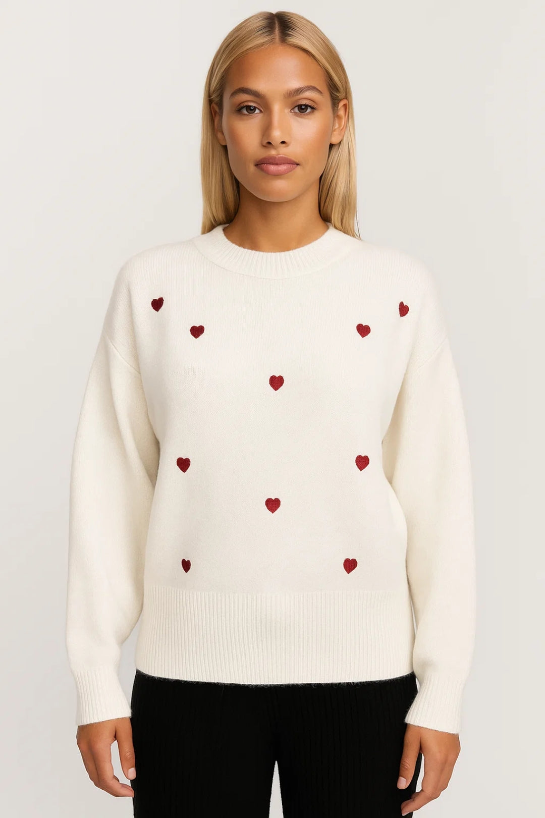 Romilly white sweater with red heart pattern, front view on model