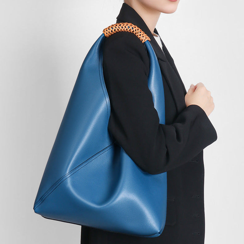 Sienna slouchy top handle bag in royal blue carried on the shoulder