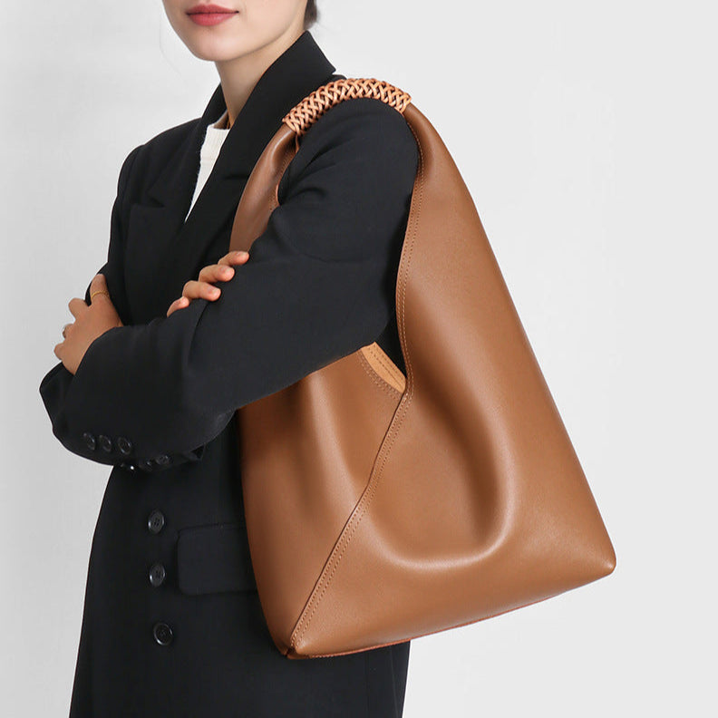 Sienna slouchy top handle bag in sienna brown carried on the shoulder