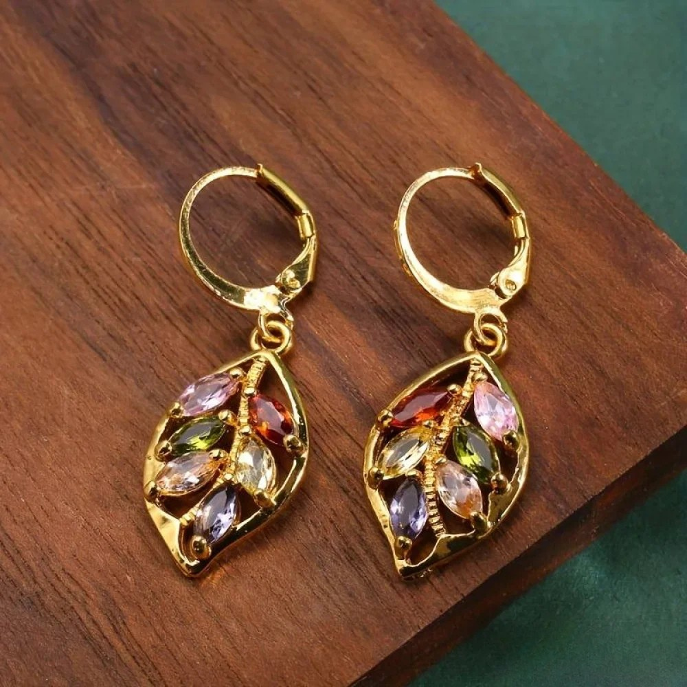 Sylvana vintage golden leaf earrings with colourful zirconia stones, close-up view