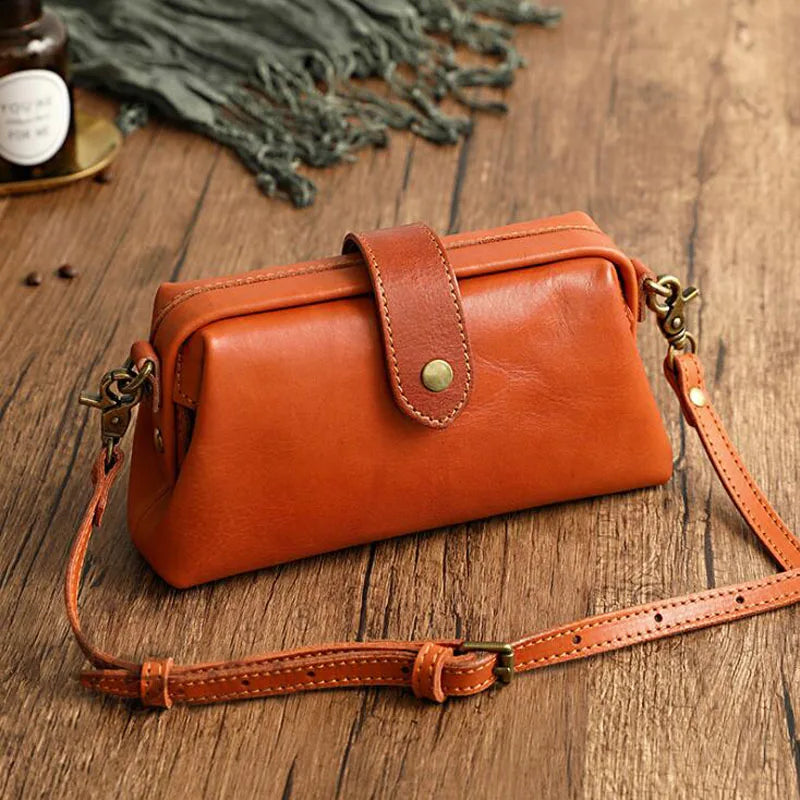Cressida mini crossbody bag in cognac, angled front view